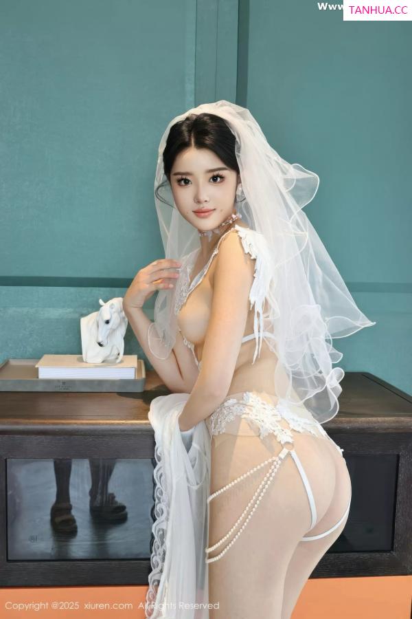   [XiuRen]高清写真图 2025.07.18 No.10559 糯梨子 白色婚纱第16张图片